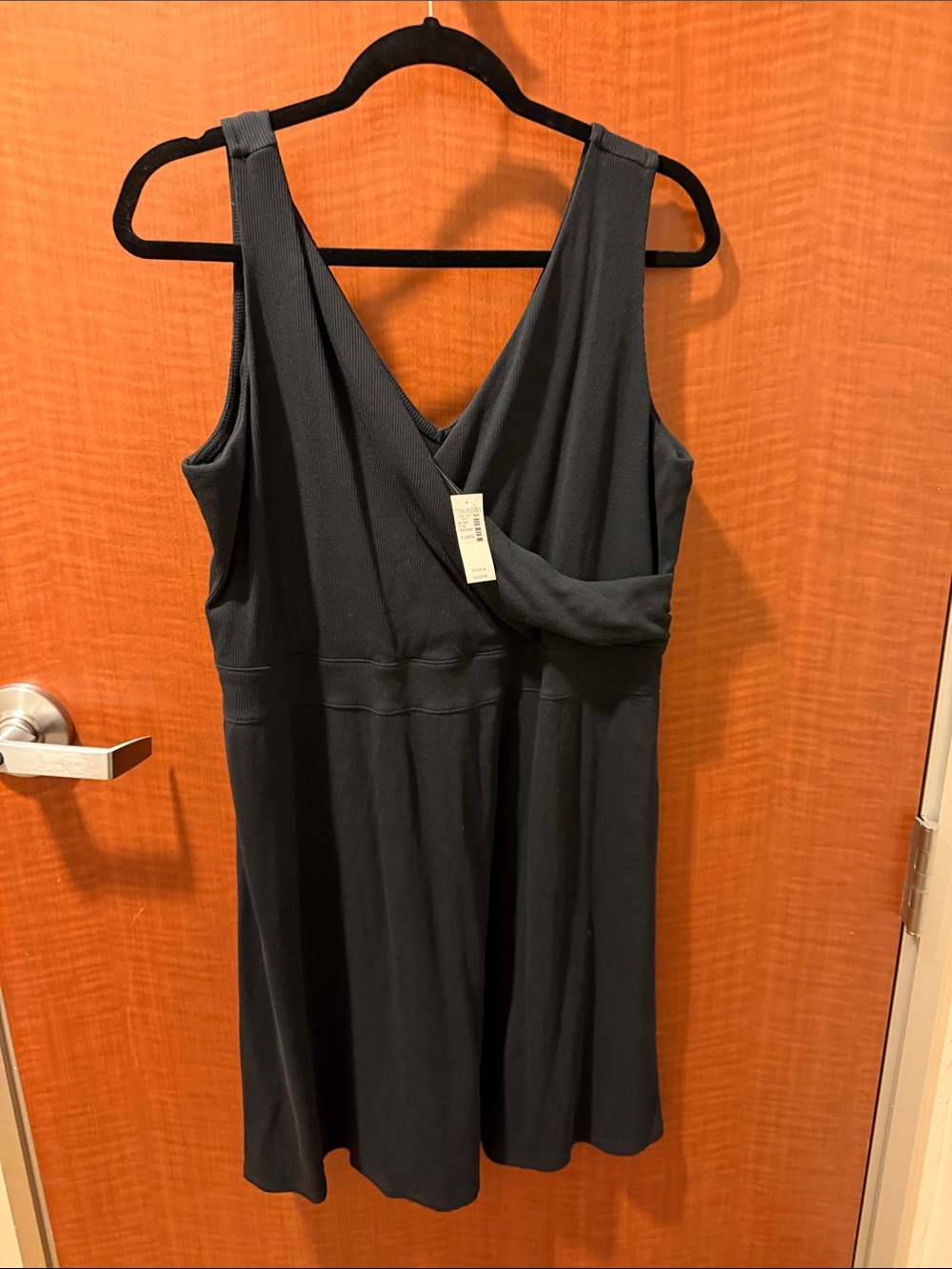 Sleeveless Black V‑Neck Midi Dress with Wrap Front
